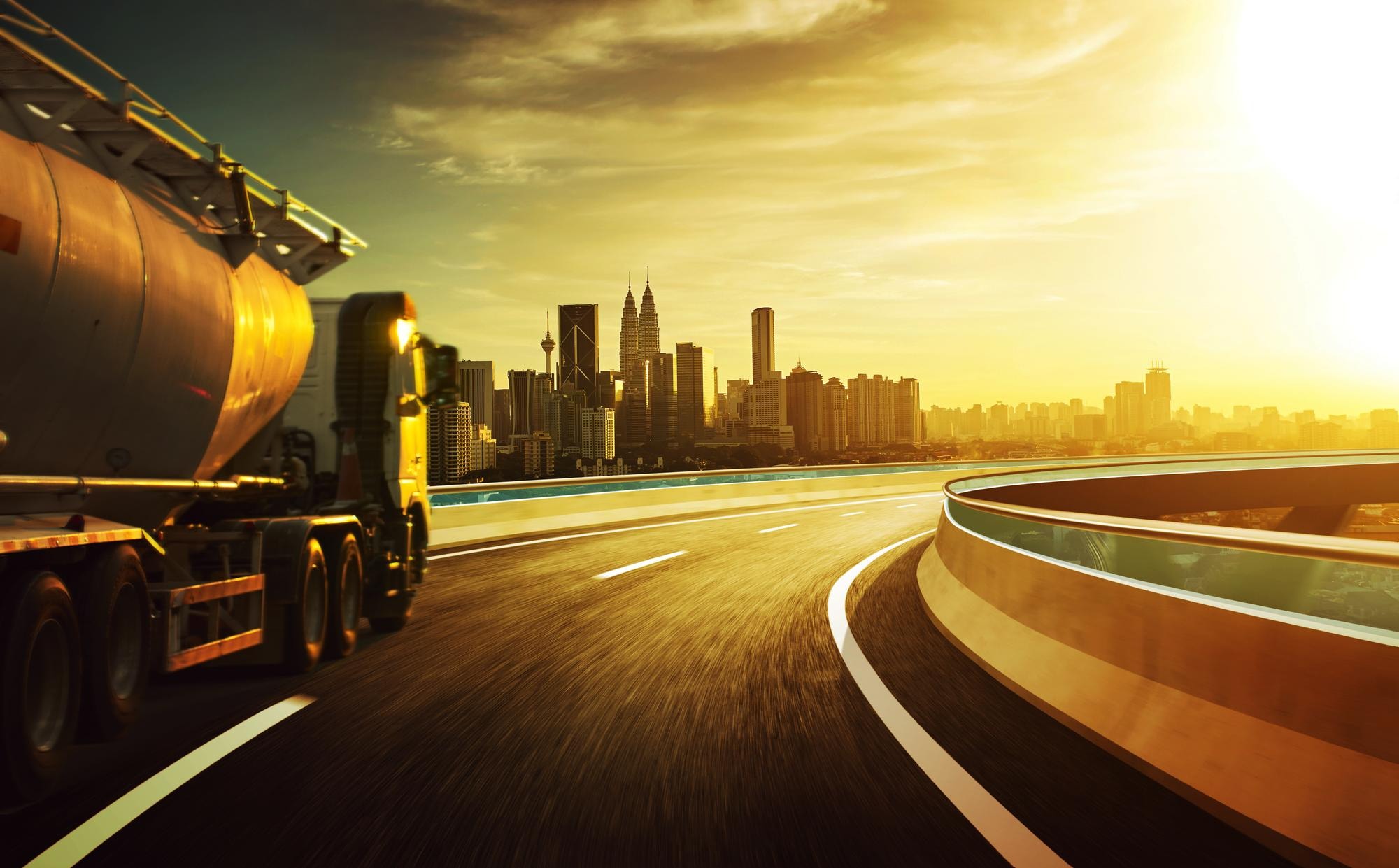 Energy logistics corridor leading toward a modern city skyline