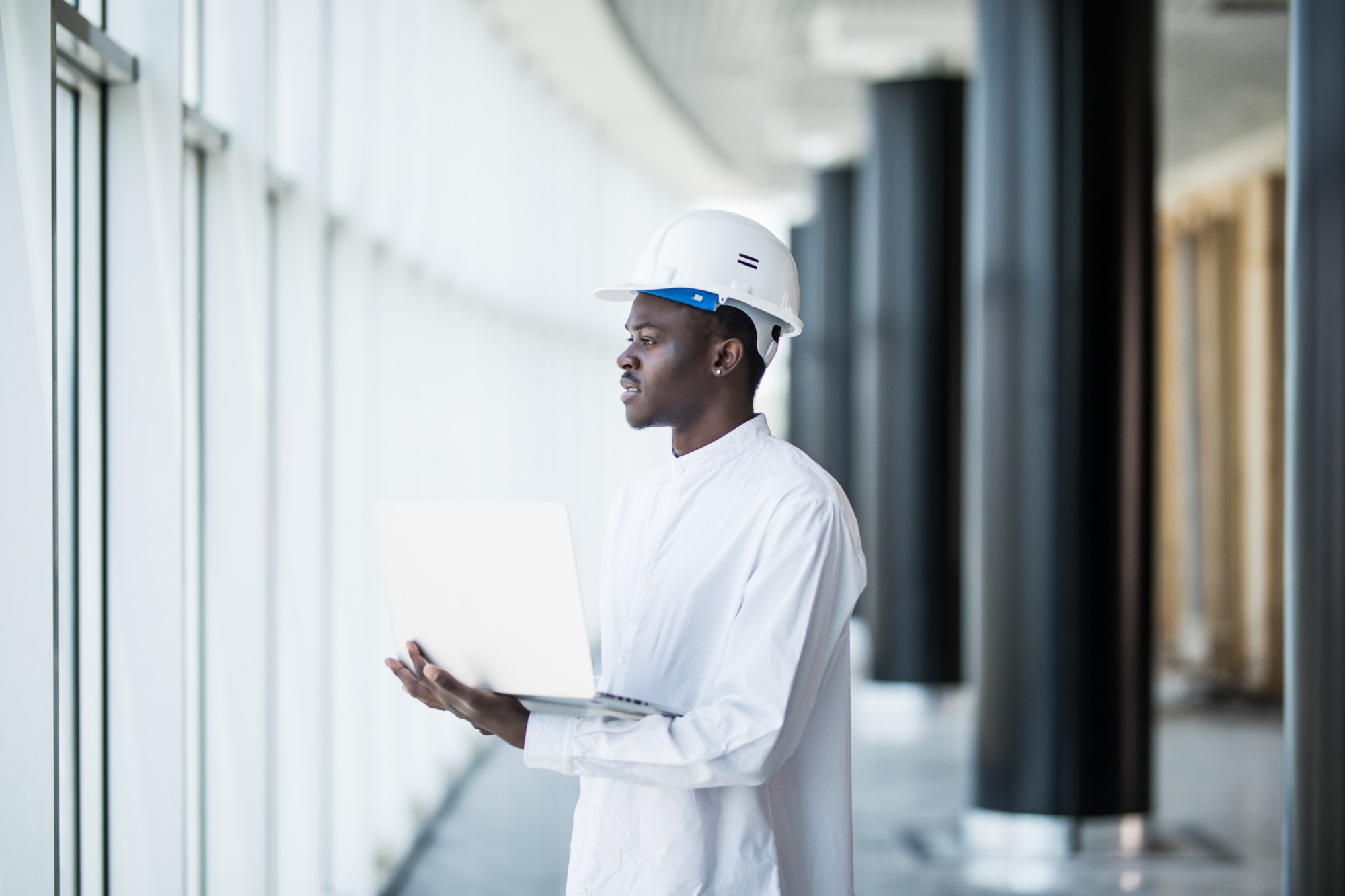 Project professional reviewing commercial information on a laptop